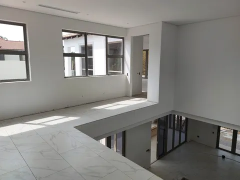 Interior refurbishment with tiled floor and open rooms
